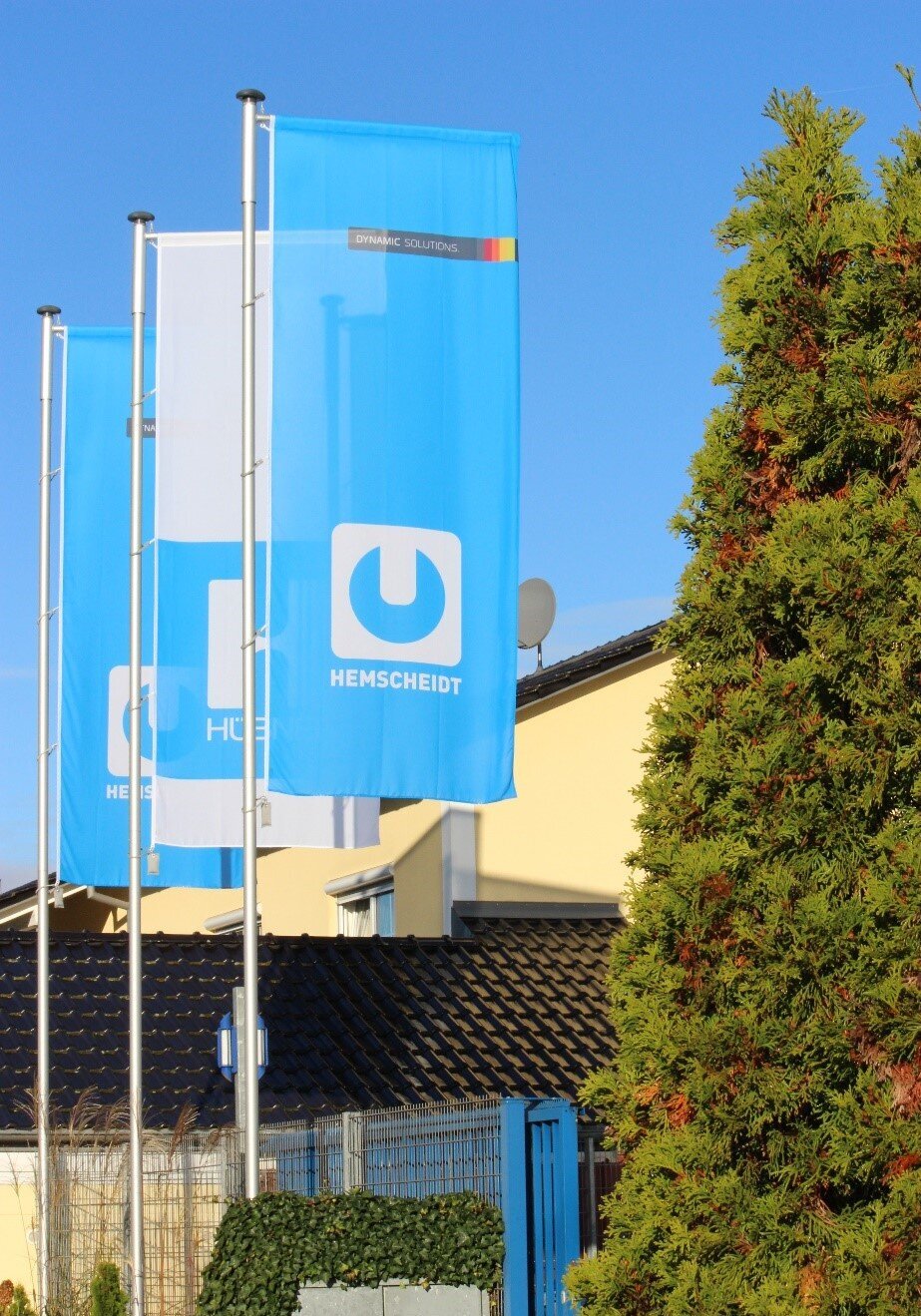 Company flag with the HEMSCHEIDT Rail logo