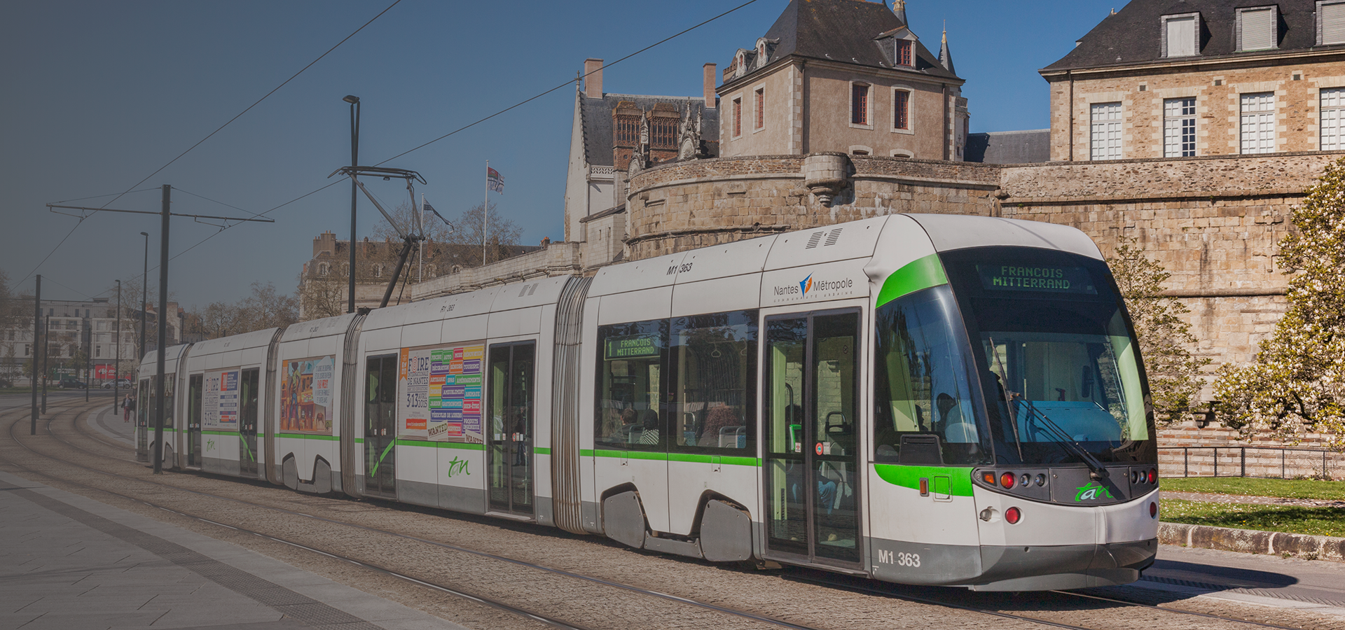 Example photo of the front-end of a tram in a city setting 